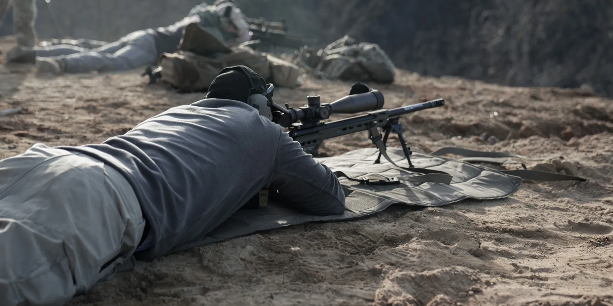 Engaging targets with a long range precision rifle.