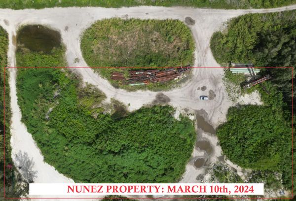 Aerial view of Nunez Property with greenery and dirt roads.