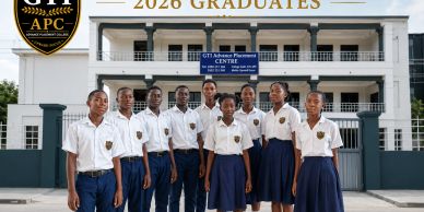 Ten students in uniform posing outside a school building for their 2026 graduation.
