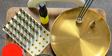 Tray set up for acupuncture treatment with incense sticks, moxa, a lighter and moxa cones