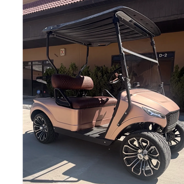 Stylish pink golf cart with black roof and seats.