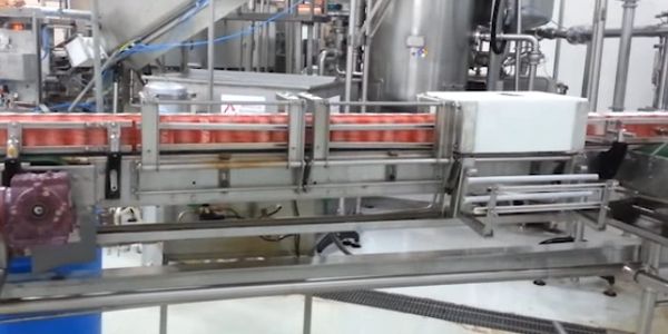 HP Invertor is inverting cans on a high-speed production line. 
