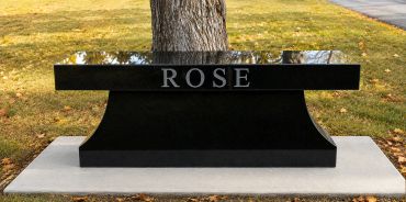 Black granite bench with the name ROSE engraved.