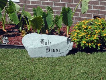 Rock sign with house name in front garden.