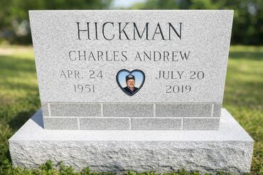 Headstone designed with the intent of being sat upon as a bench.