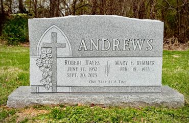 Headstone for Andrew family with floral design.