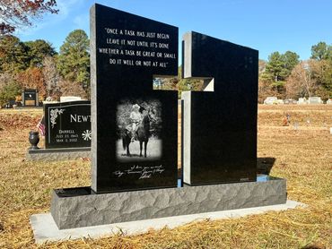 Unique gravestone with a motivational quote and horse image.