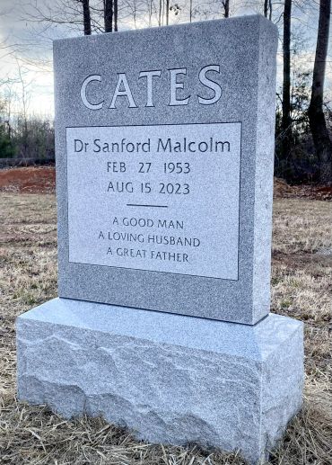 A gravestone for Dr. Sanford Malcolm Cates with dates and a loving epitaph.