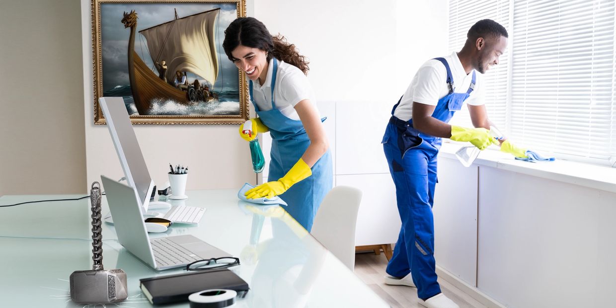Two janitors cleaning an office
