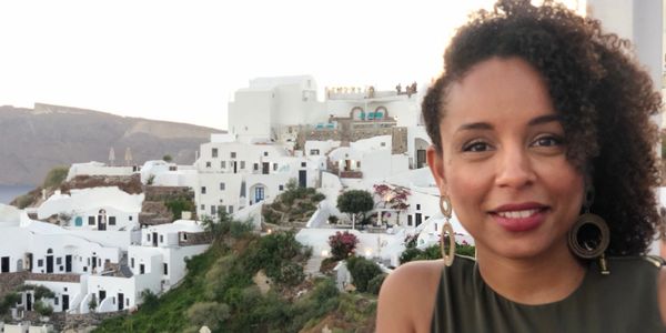 Dr. Tanya Maloney with a view of Santorini