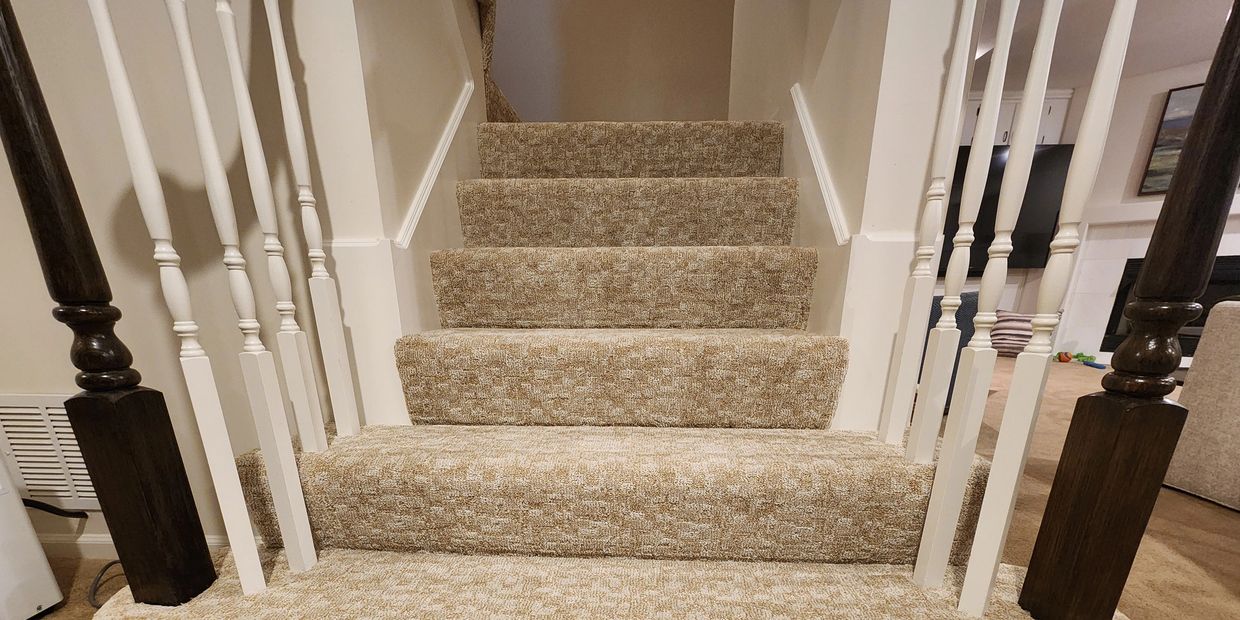 beige carpeted stairs with brown carpet and white balusters installed olathe ks
