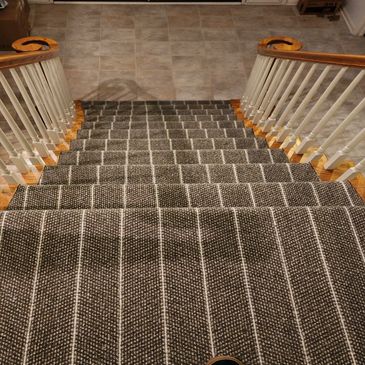 Strip grey and white stair carpet installation done by Flooring It KC in overland park 