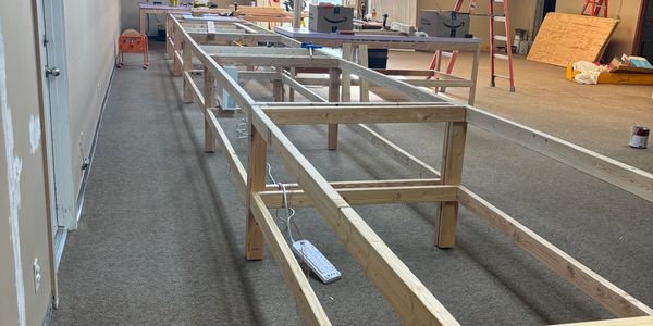 Beginning the benchwork for the different scale railroads in the club room.