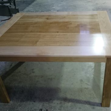 Polished wooden table in a workshop.