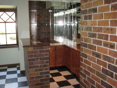 Interior brick bar area with checkered floor.
