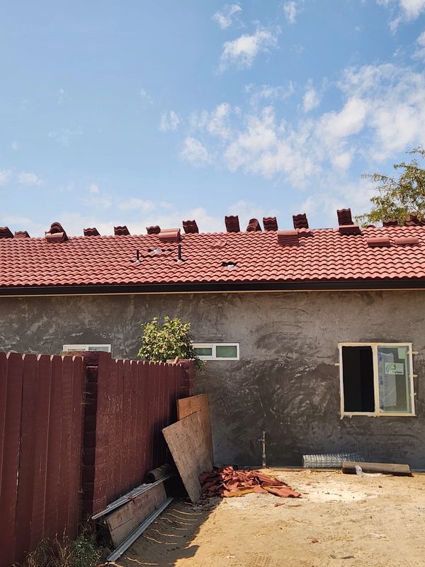 Professional W-style tile roof replacement and installation.