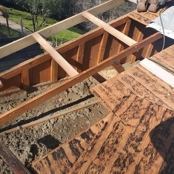 Replacement of damaged plywood decking and installation of new fascia boards.