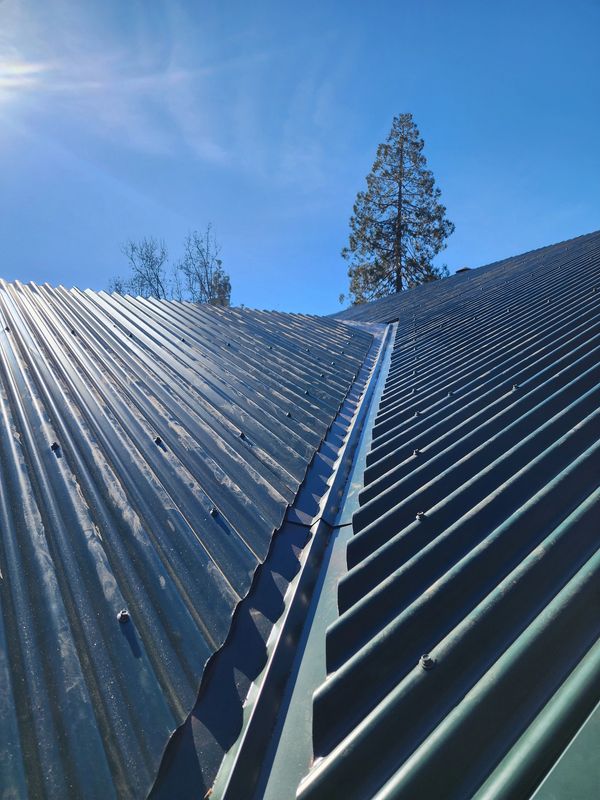 Corrugated metal roof installation for maximum durability and water drainage.