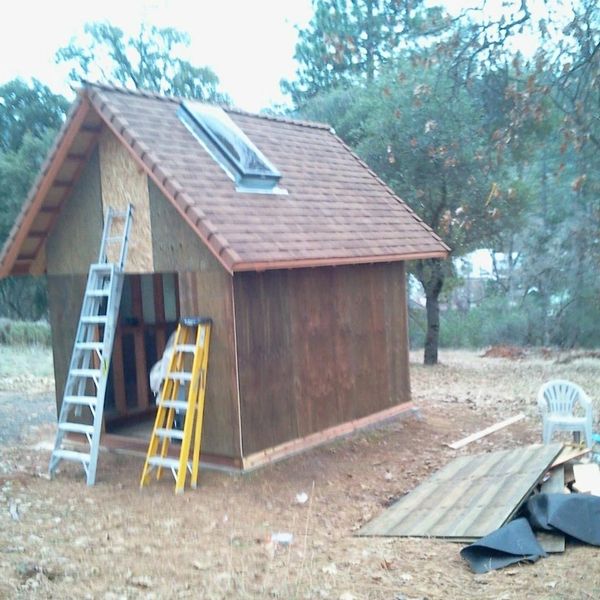 Custom shingle roof installation for a residential water pump house.
