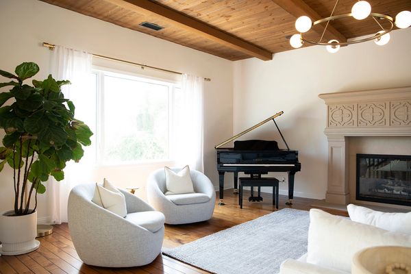 Image of exposed beams, natural colored wood ceiling with modern living room pallet in SoCal home