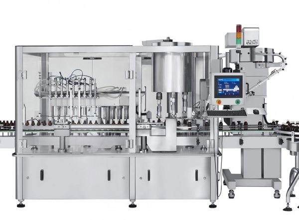 Automated liquid filling machine for bottles.