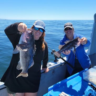 two friends at coos bay, oregon fishing for rockfish and lingcod on a charter fishing boat