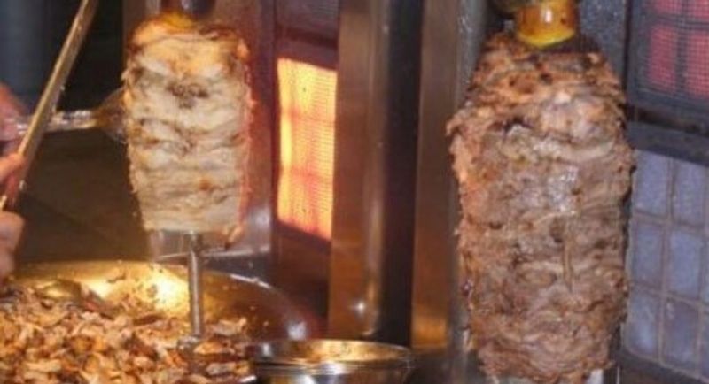 Chicken and beef shawarma on vertical spits