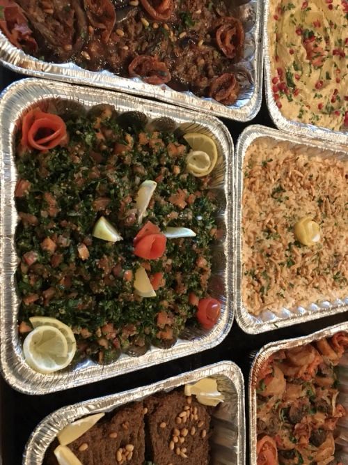 Catering trays of tabbouleh and rice