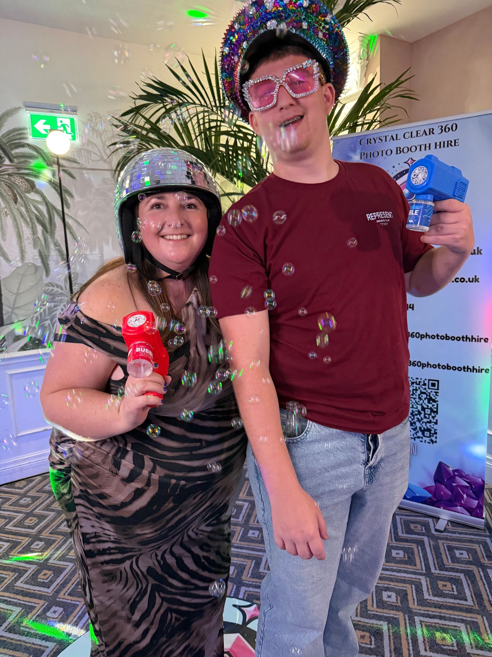Guests enjoying Crystal Clear 360 luxury photo booth hire at an event in South Wales.