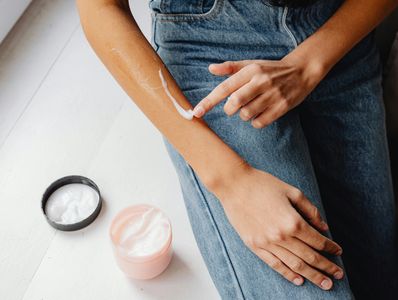 woman applying a hand cream