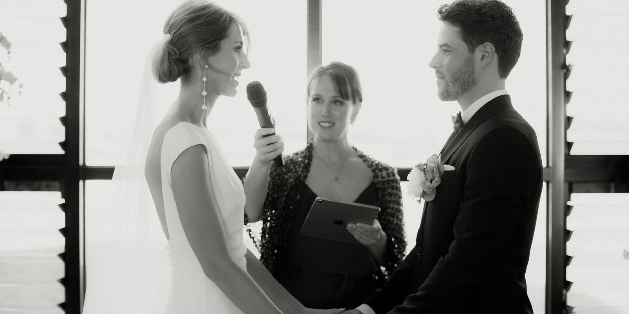 Wedding ceremony officiated by a marriage celebrant as the bride says her legal vows to the groom