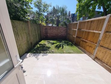 Porcelain patio and new kawn. Completed in a weekend.