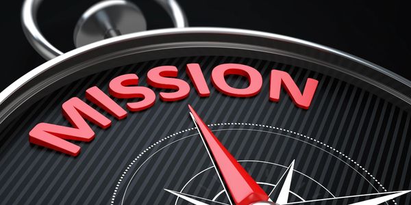 Compass pointing towards the word 'MISSION'.