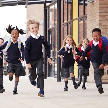 Students running in uniform 