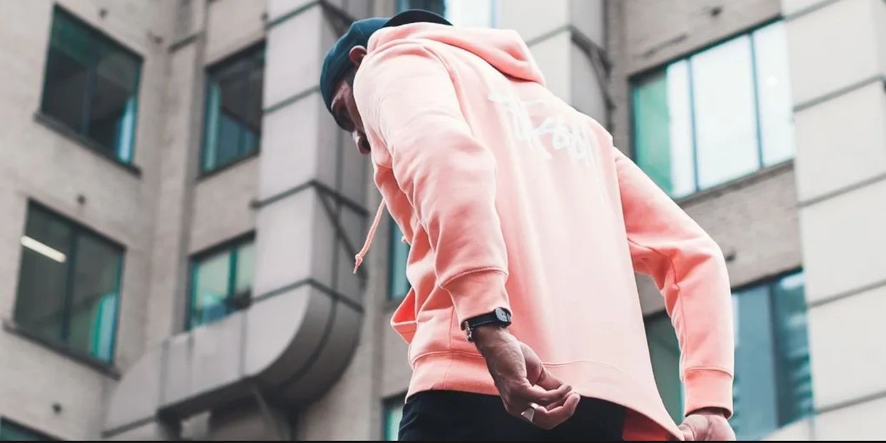 Model wearing quality hoodie made by The Khane