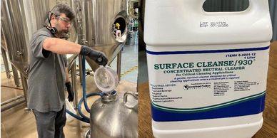 A worker pouring Surface Cleanse 930 into a container in an industrial setting.