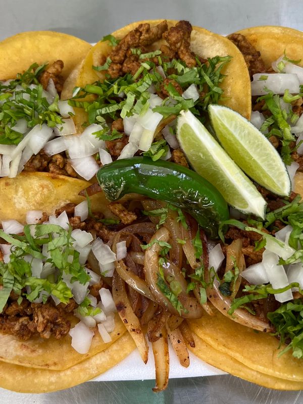 Fajitas tacos  with grilled onions, Serrano pepper onions and cilantro 