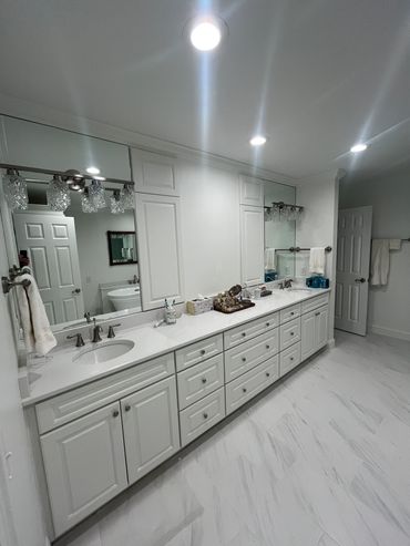Vinings master bathroom after remodeling: white double vanity with recessed medicine cabinets