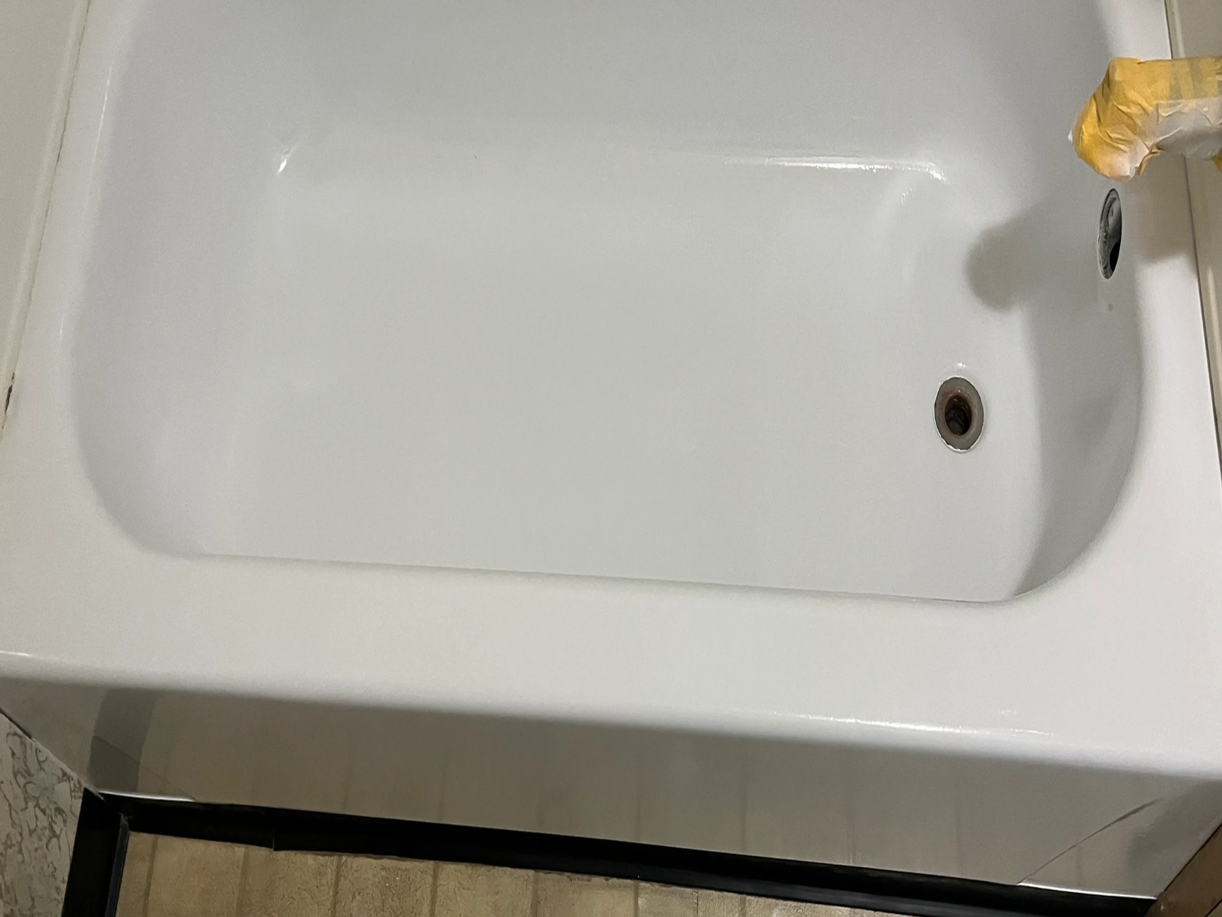 Chipped white bathtub repaired and refinished by Johnson Bath Repair in Worcester County, MA