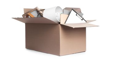 A cardboard box filled with various household items.