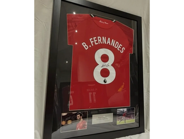 Framed B. Fernandes football jersey with photos and plaque.