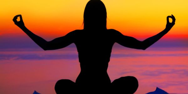 Yoga at the beach at sunset.