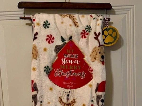 Festive Christmas blanket with dog-themed holiday design.