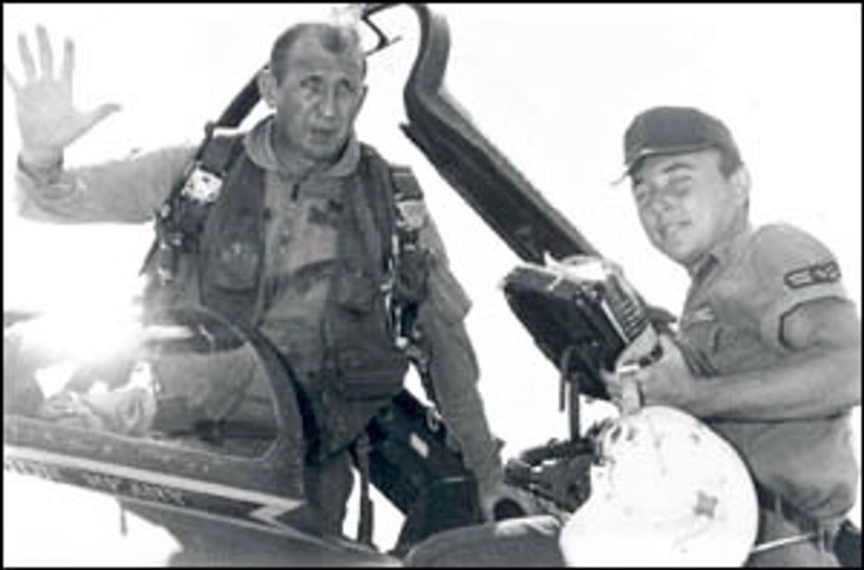 Major Clyde Seiler in his F-100 Sabor jet fighter.