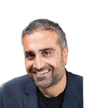 Smiling man with short hair and beard in a dark blazer.