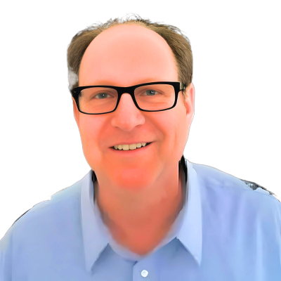 Smiling man with glasses and a blue shirt against a black background.