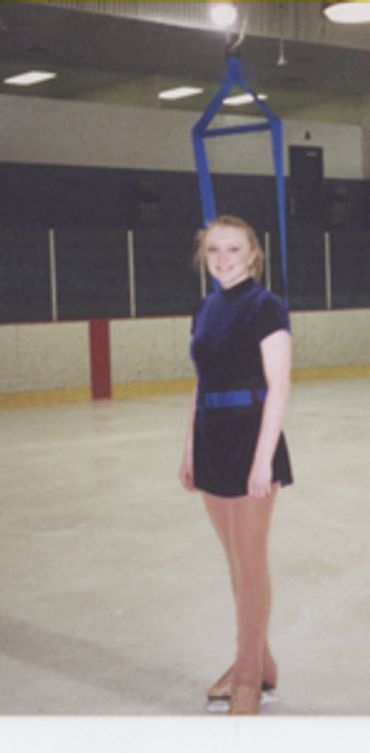 figure skater in jump harness