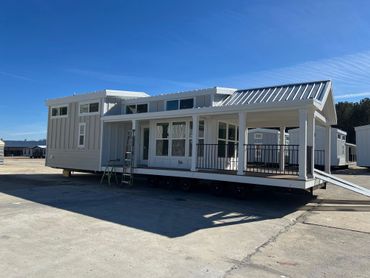 A modern modular home under clear blue skies.