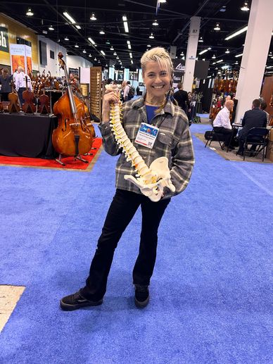 Woman holding spine on the display