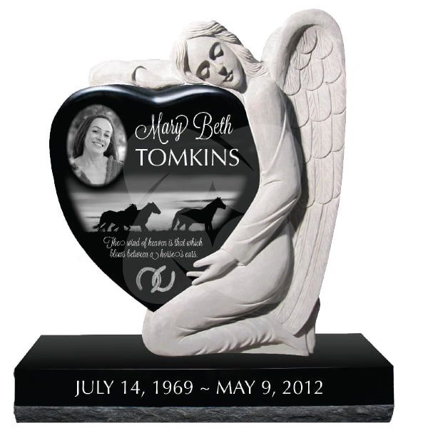 Angel statue embraces heart-shaped memorial plaque honoring Mary Beth Tomkins.
